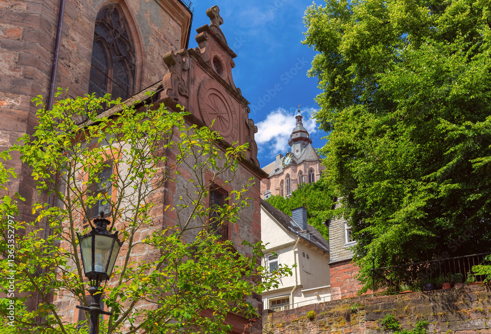 Landgrafenschloss castle on hill above traditional fachwerk houses in Marburg Germany on a sunny summer day