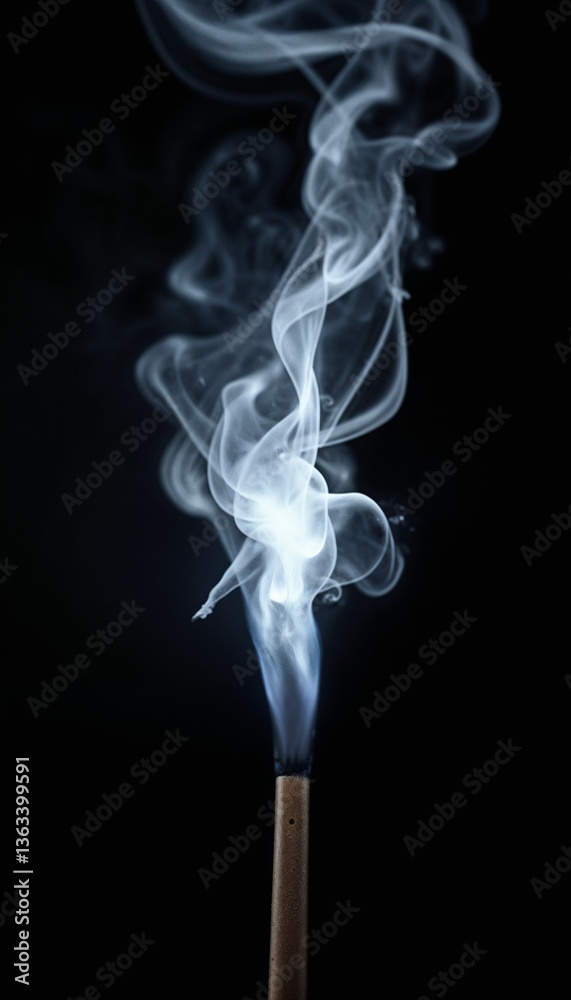 Close-up of smoke swirling from an incense stick against a black background Close-up of smoke swirling from an incense stick against a black background