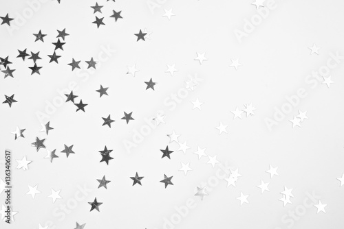 Silver Star Confetti on White Background.