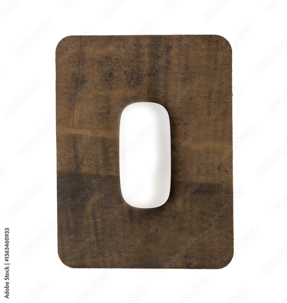 Obraz premium White mouse on abstract brown leather mouse pad isolated on white background