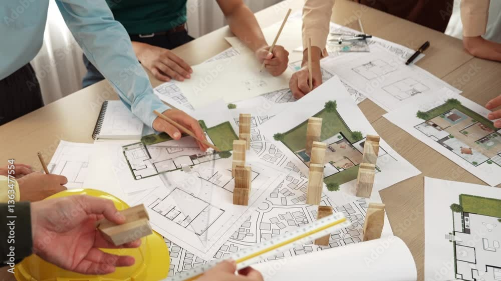Architect and safety engineer discussion about building construction use blueprint on table with architectural document, measurement tool and wooden block scatter around at modern office. Delineation. Architect and safety engineer discussion about building construction use blueprint on table with architectural document, measurement tool and wooden block scatter around at modern office. Delineation.