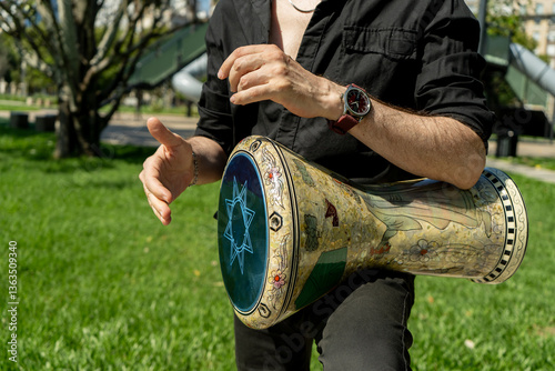 Fotografie Hands of a percussionist playing his derbake or darbuka of Arabic origin