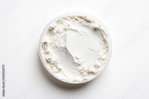 A clear bowl filled with a generous amount of white flour, ready for baking.