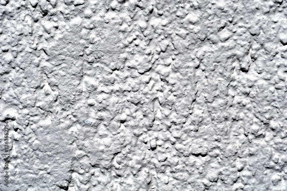 Irregular surfaces of a house facade in white Irregular surfaces of a house facade in white
