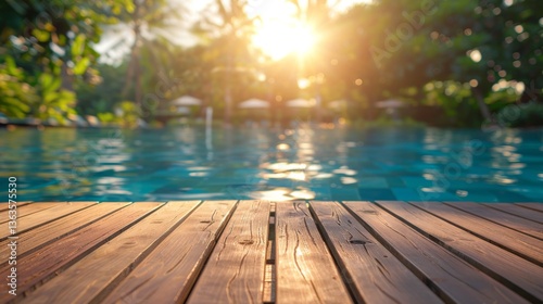 Swimming pool with a wooden deck in the middle of it, surrounded by lush greenery and trees in the background, Tropical background for your products presentation.