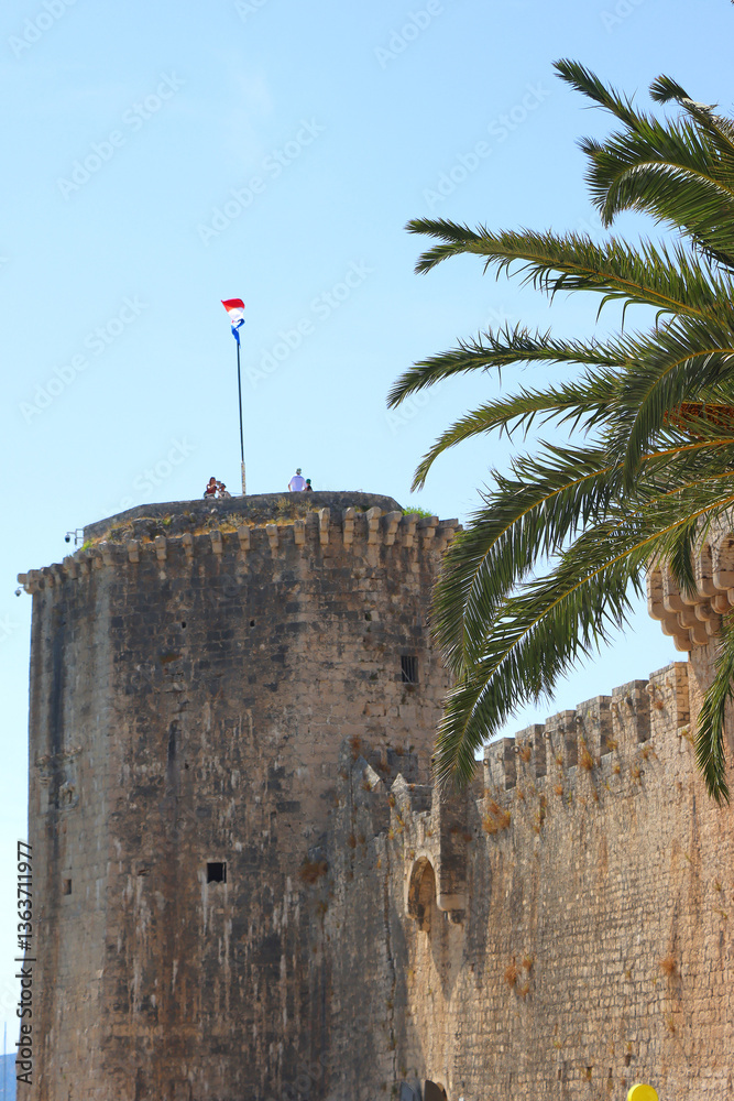 Historical Kamerlengo Fortress in Trogir, Croatia and Croatian flag.