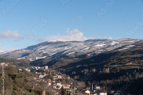 Snow-Covered Mountains under a Clear Blue Sky
