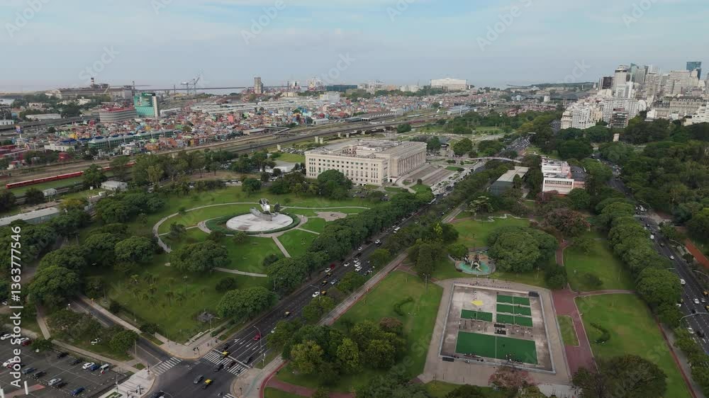 : Drone aerial shot of Avenida del Libertador in Buenos Aires, Argentina, showcasing the iconic Law School (Facultad de Derecho) and the Floralis Genérica sculpture. : Drone aerial shot of Avenida del Libertador in Buenos Aires, Argentina, showcasing the iconic Law School (Facultad de Derecho) and the Floralis Genérica sculpture.