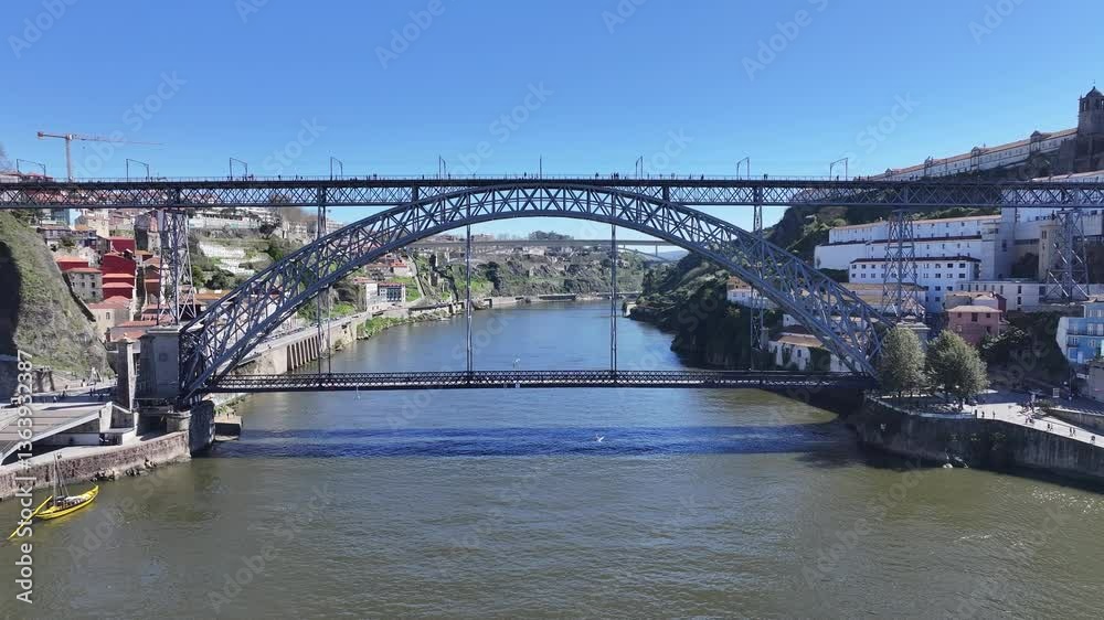 Luis I Bridge At Porto Porto District Portugal. Birds Eye View Of Suspension Bridge With Cars Driving Across. Coast Horizon Seaside Summertime. Remote Location Seaside Panning Wide. Luis I Bridge At Porto Porto District Portugal. Birds Eye View Of Suspension Bridge With Cars Driving Across. Coast Horizon Seaside Summertime. Remote Location Seaside Panning Wide.