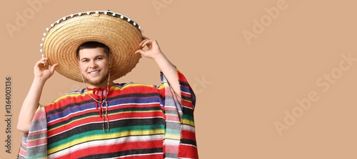Happy young man in sombrero...