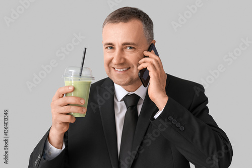 Mature businessman with gla...