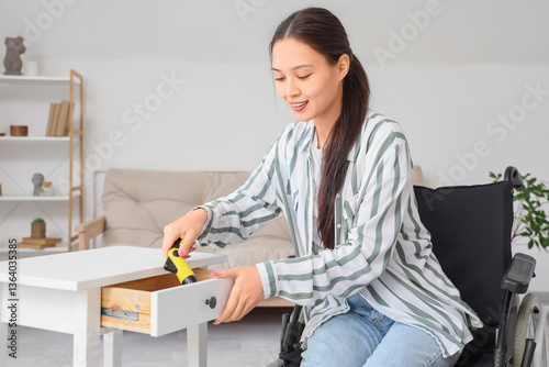 Young asian woman in wheelc...
