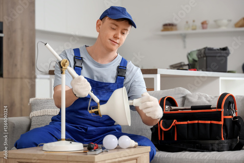 Male technician changing li...