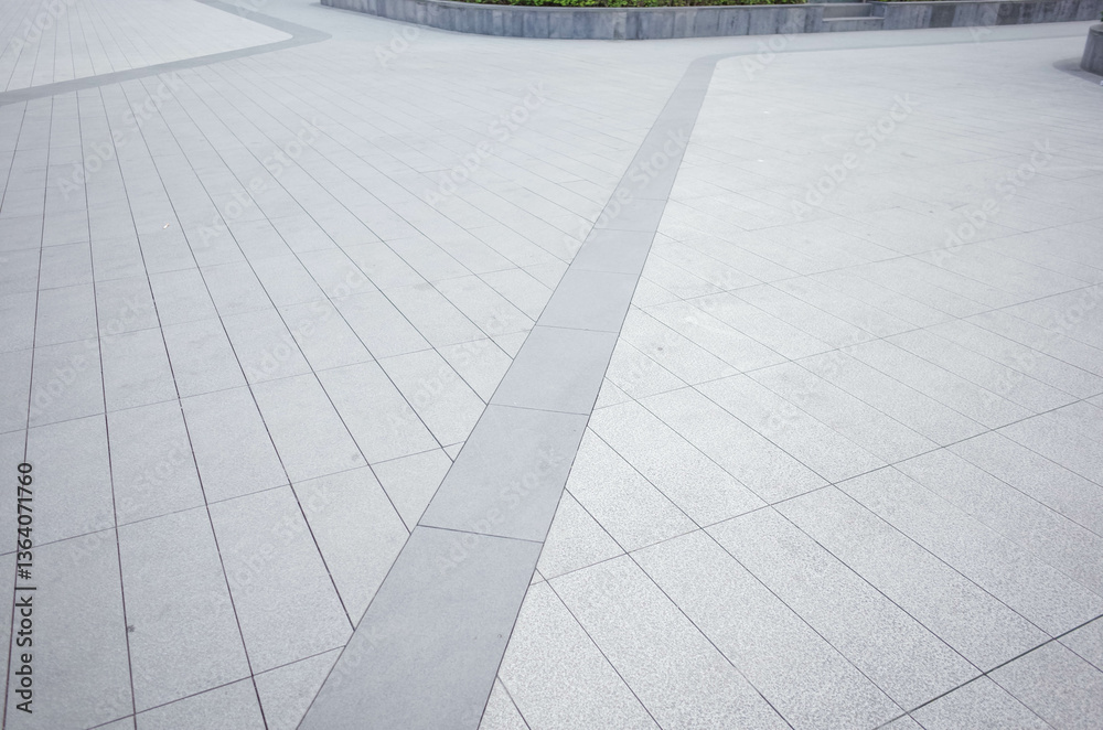 Grey brick stone street road. Light sidewalk, pavement texture. Granite outdoor tiled floor.