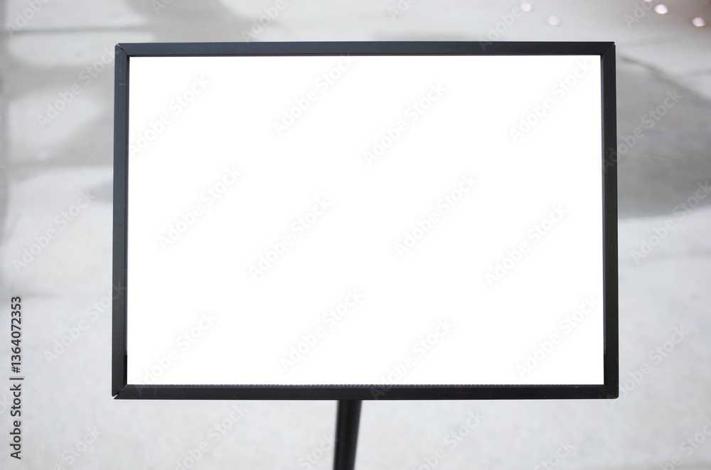 Blank white outdoor advertising stand or sandwich board mock up template. Clear street signage board placed by an outdoor dinning area of a restaurant. Background texture of standee on street.