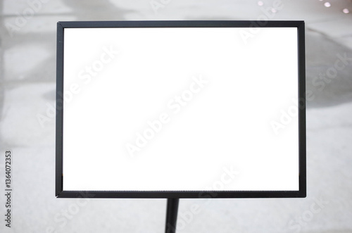 Obraz na płótnie Blank white outdoor advertising stand or sandwich board mock up template. Clear street signage board placed by an outdoor dinning area of a restaurant. Background texture of standee on street. w salonie