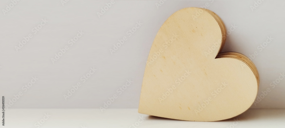 Obraz premium Crafting love heart-shaped wooden cutout display home decor minimalist natural light close-up heartfelt emotion