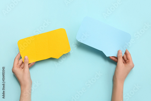 Female hands with blank pap...