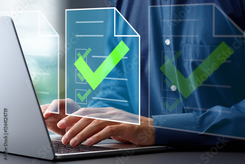 Document approval process and completion. Approval workflow and legal document compliance. Businessman using laptop computer to approve documents.