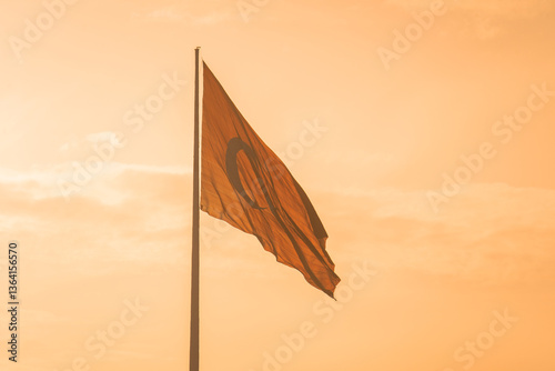 Turkish flag against a background of sunset sky