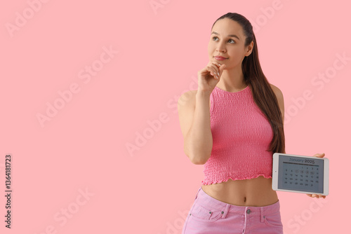 Thoughtful young woman hold...