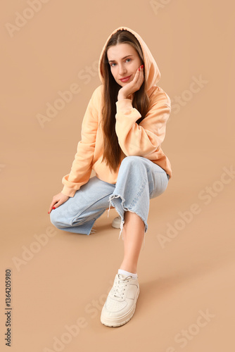 Stylish young woman in hood...