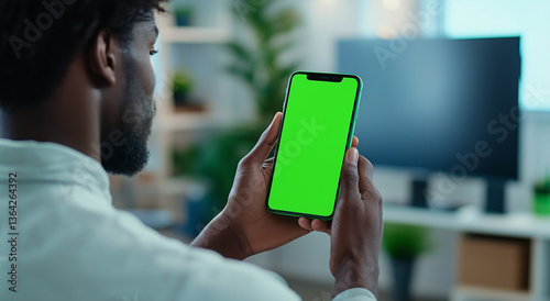 African Man Holds Phone With Green Screen, Mockup Template, Chroma Key, Modern Device