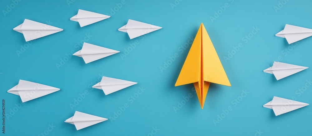 Yellow Paper Airplane Leading Group of White Paper Airplanes Against Bright Blue Background Yellow Paper Airplane Leading Group of White Paper Airplanes Against Bright Blue Background