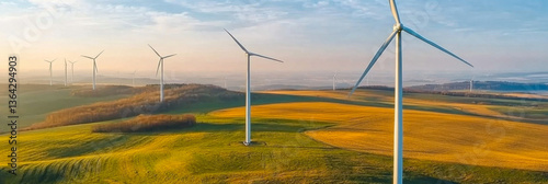 Obraz na płótnie Panoramic view of wind farm or wind park, with high wind turbines for generation electricity w salonie