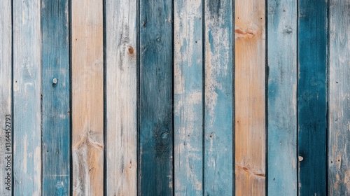 Vertical weathered wooden planks with various shades of blue and beige.  Aged, rustic, and distressed wood paneling.  Natural wood grain visible.  Texture background.  .
