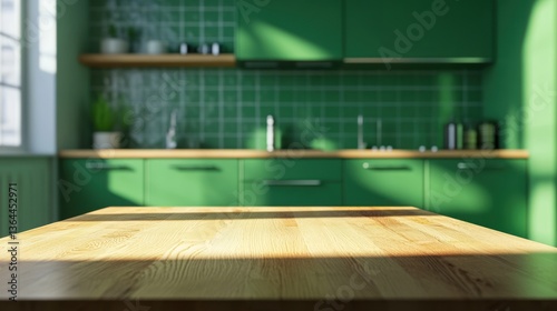 Empty wooden table in front of a green kitchen. Sunlight streams in through the window. Blurred background of cabinets and tiles.