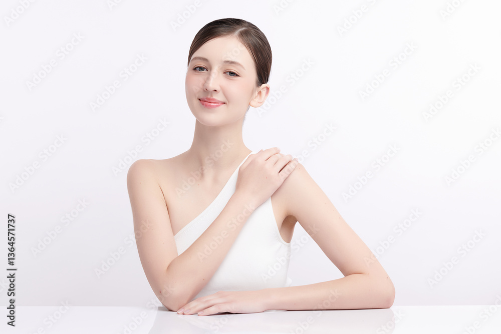 A beautiful young woman with clean, fresh skin against a white background. Skincare, facial treatment, cosmetology, beauty, and spa. An elegant portrait of an woman. A beautiful young woman with clean, fresh skin against a white background. Skincare, facial treatment, cosmetology, beauty, and spa. An elegant portrait of an woman.