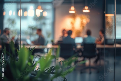 Wallpaper Mural Blurred background of a business meeting in a modern office with people sitting at a table, a team working together having a discussion. View through a glass wall Torontodigital.ca