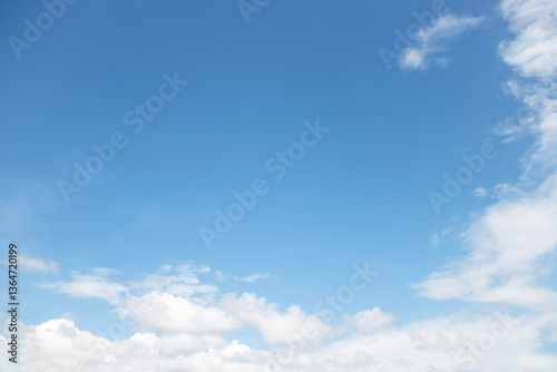 Obraz na płótnie Blue sky background and white clouds soft focus, and copy space horizontal shape. w salonie