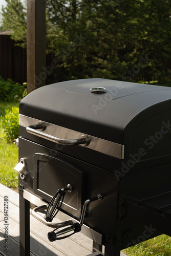 Obraz na płótnie New portable charcoal barbecue grill for summer party at patio. Summer. Outdoors. BBQ grill. w salonie
