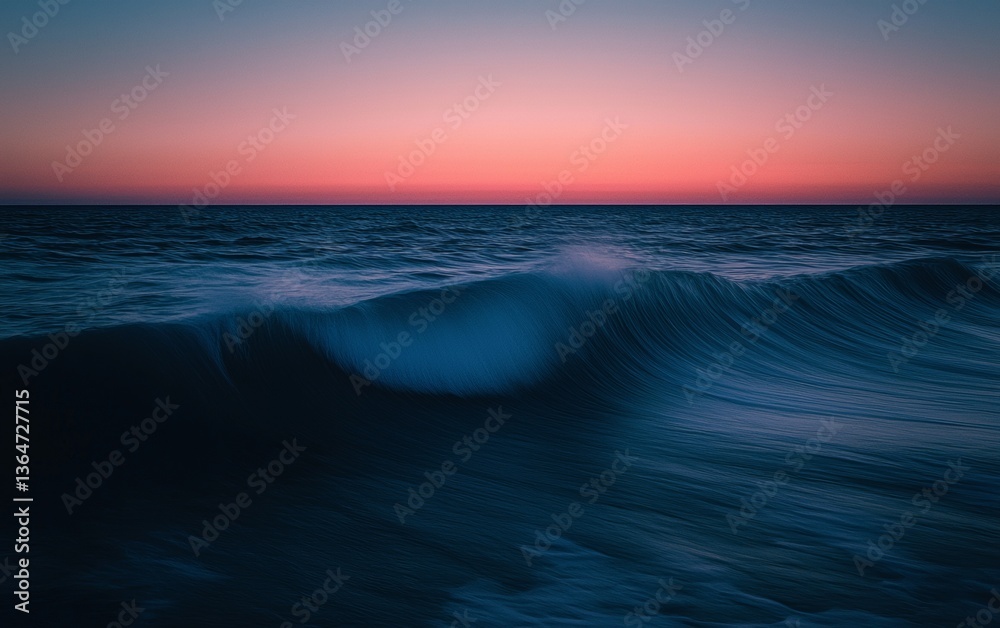 Obraz premium Calm waves gently rolling towards the shore at sunset over the ocean horizon