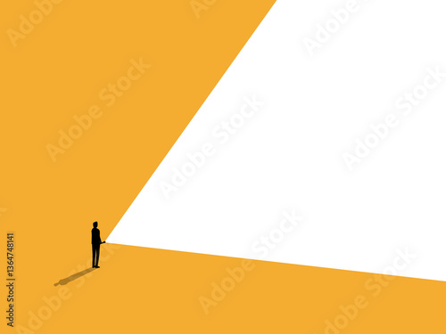 Businessman stands holding a flashlight shining it forward