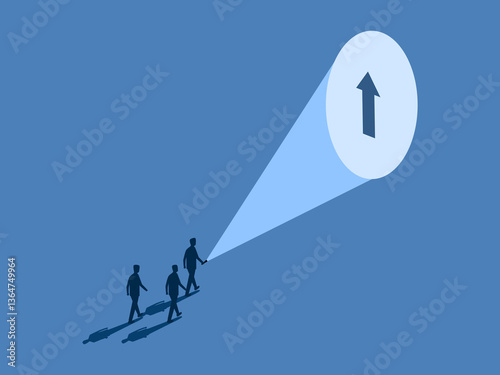 Businessman holding a flashlight to guide his colleagues to the direction arrow