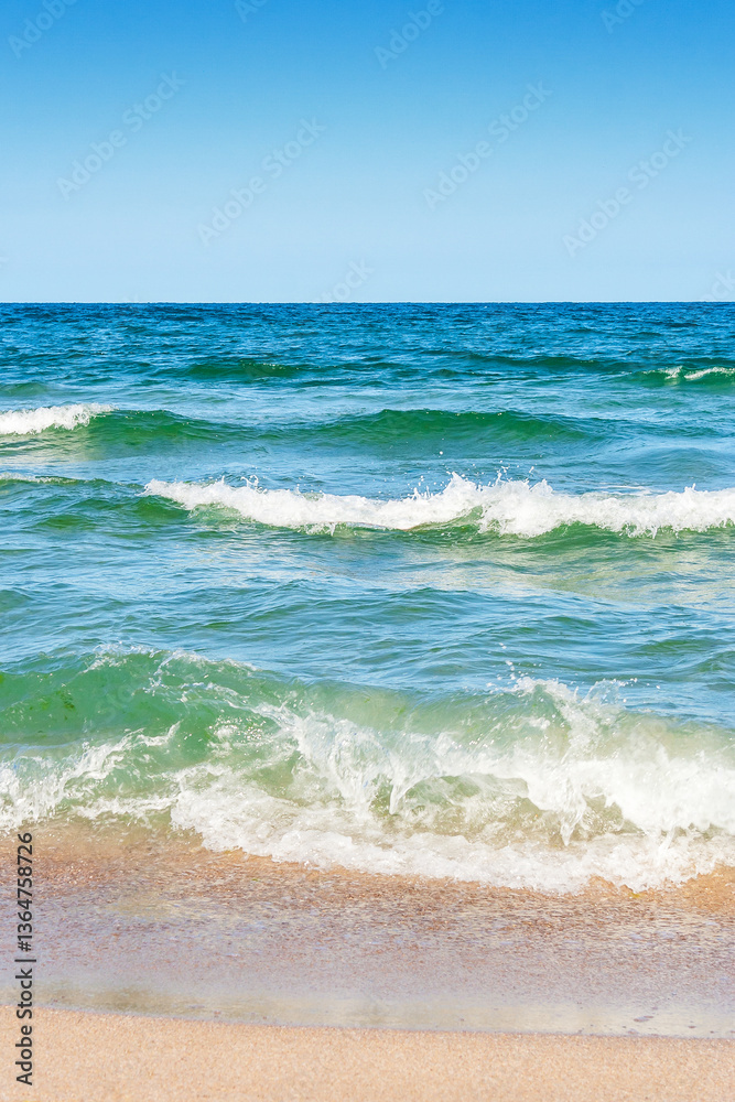 sea scenery in summer. beach with golden sand. wonderful vacation background with transparent calm waves and blue sky. wave splash