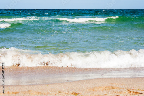 Obraz na płótnie sea scenery in summer. beach with golden sand. wonderful vacation background with transparent calm waves and blue sky. adventure at the sandy seaside w salonie