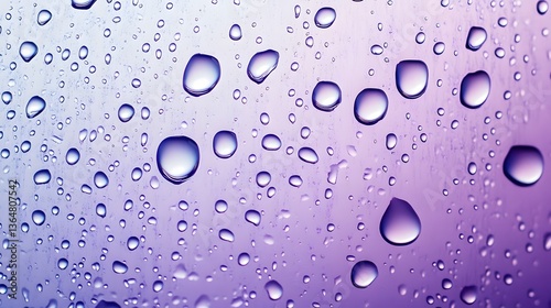 Water droplets on a gradient background, vibrant colors blending from purple to blue, ideal for design or creative projects.