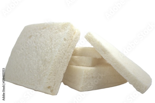 White bread arranged in a simple and friendly manner, with slices of bread stacked and slightly tilted.