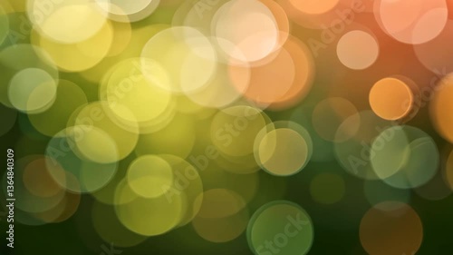 Dreamy Abstract Bokeh Background of Green Yellow and Orange Blurred Circles with Soft Light Texture