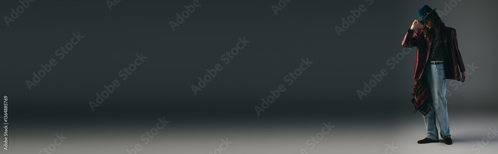 Stylish young man poses confidently in a minimalist studio setting during a fashion showcase Stylish young man poses confidently in a minimalist studio setting during a fashion showcase