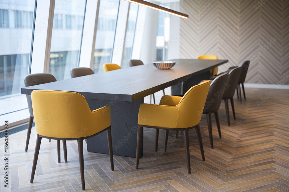 Long dark table with yellow and gray chairs in a modern office setting near large windows, showcasing a clean, professional workspace ideal for meetings or collaborations Long dark table with yellow and gray chairs in a modern office setting near large windows, showcasing a clean, professional workspace ideal for meetings or collaborations