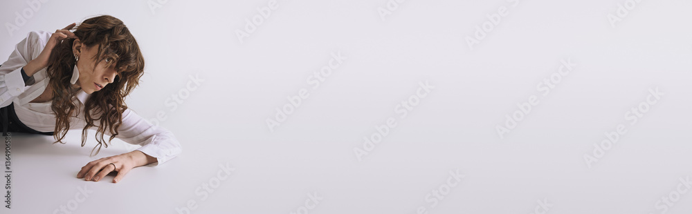 Fototapeta premium Stylish young man posing confidently in an artistic studio setting