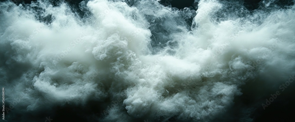 Obraz premium Dense, swirling white smoke billows against a dark backdrop, creating a dramatic, ethereal effect