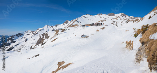 Obraz na płótnie Nebelhorn mountain top station of gondola and ski run, winter landscape Oberstdorf w salonie
