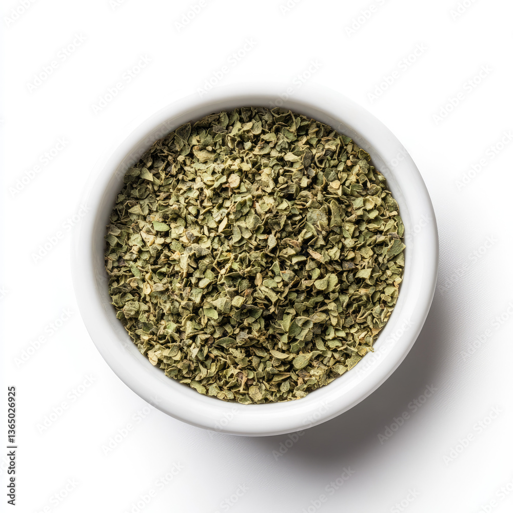 Overhead view of dried oregano in a white bowl on a white background plain