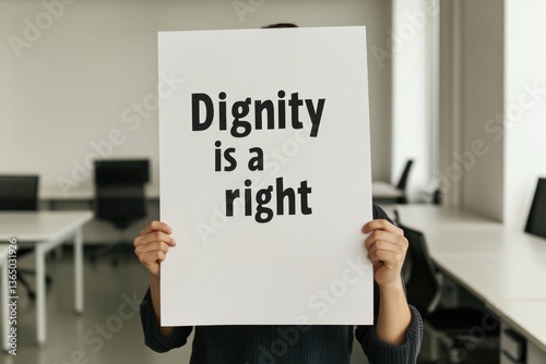 Bold message on sign highlights importance of dignity in society